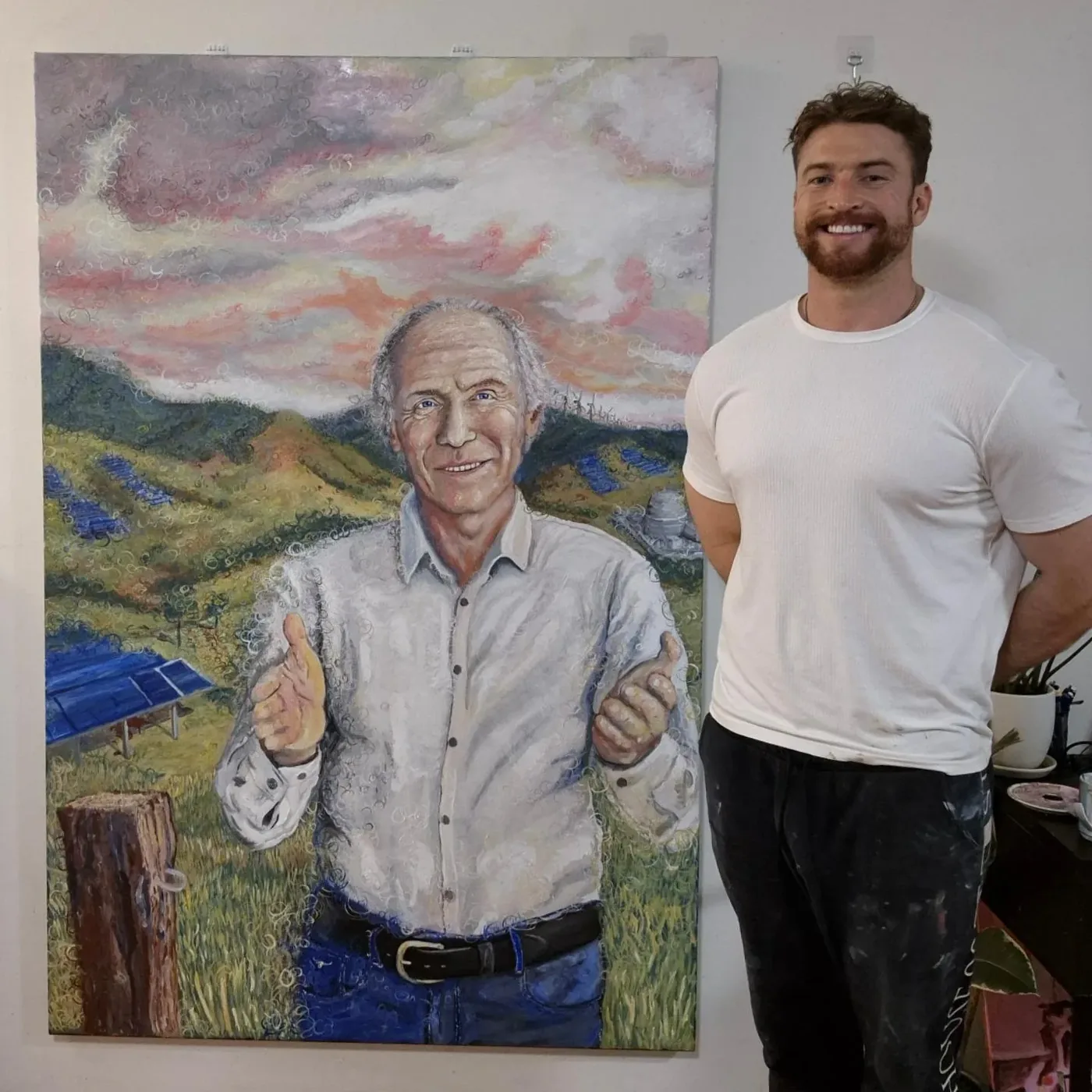 The Observer of National Science with the artist Samuel Morrow standing beside it for scale